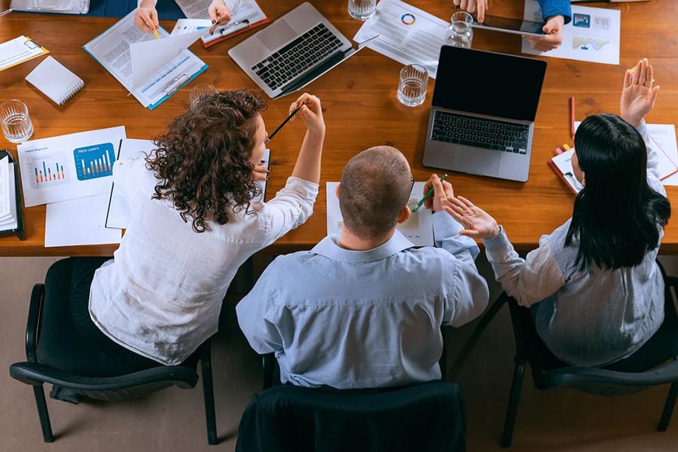 Creative employees solving a problem during a work meeting