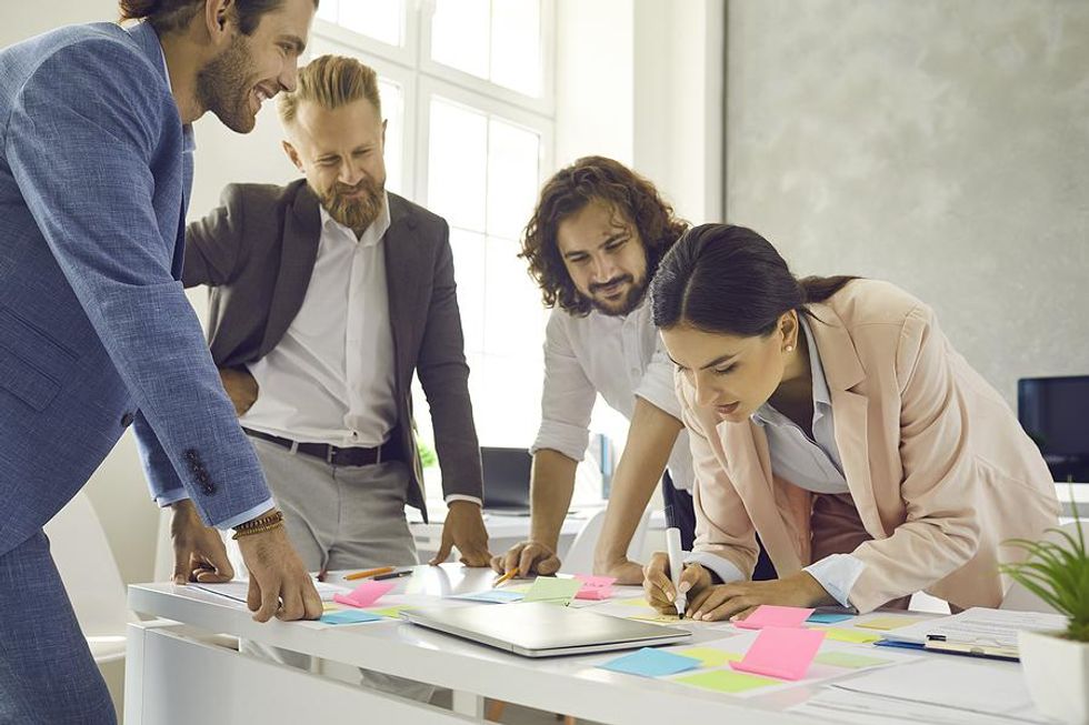 Creative employees work on a project during a meeting