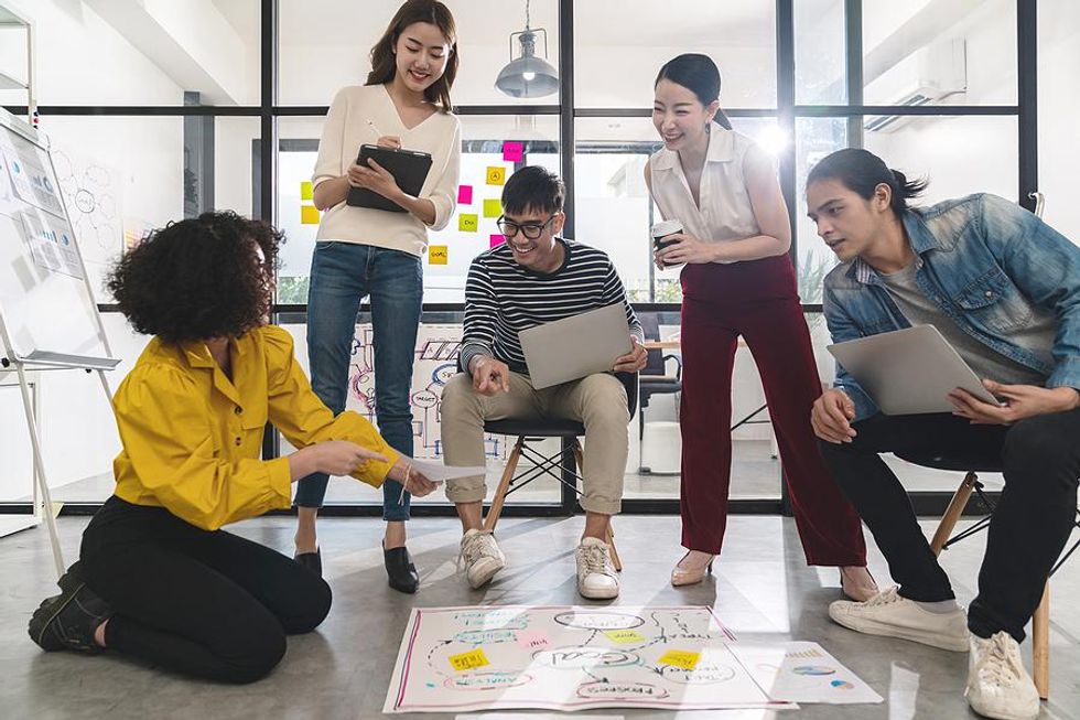 Creative employees working on a project together during a meeting