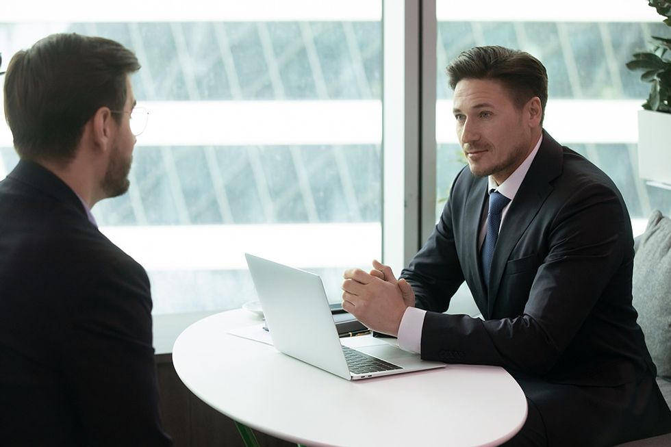 Job seeker negotiates salary with human resources professional.