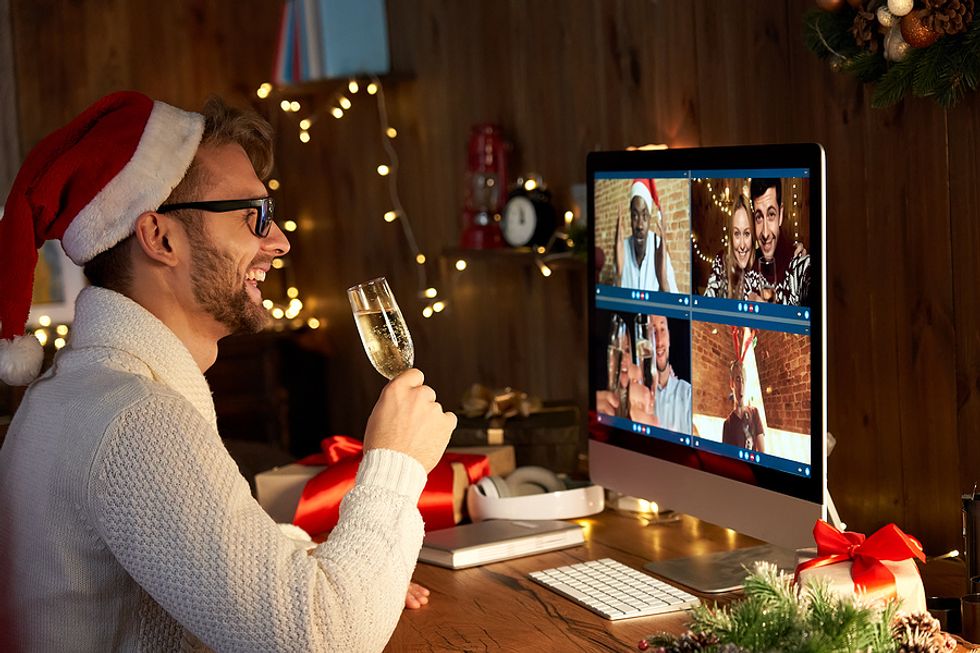 Man attends a virtual networking event during the holidays