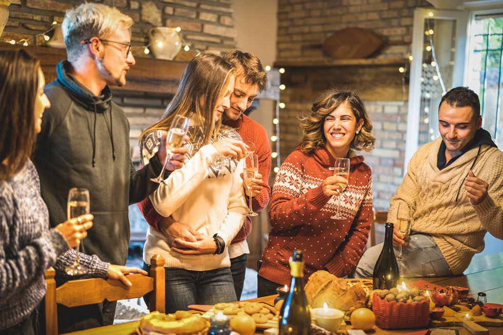 People talking and networking at a holiday party