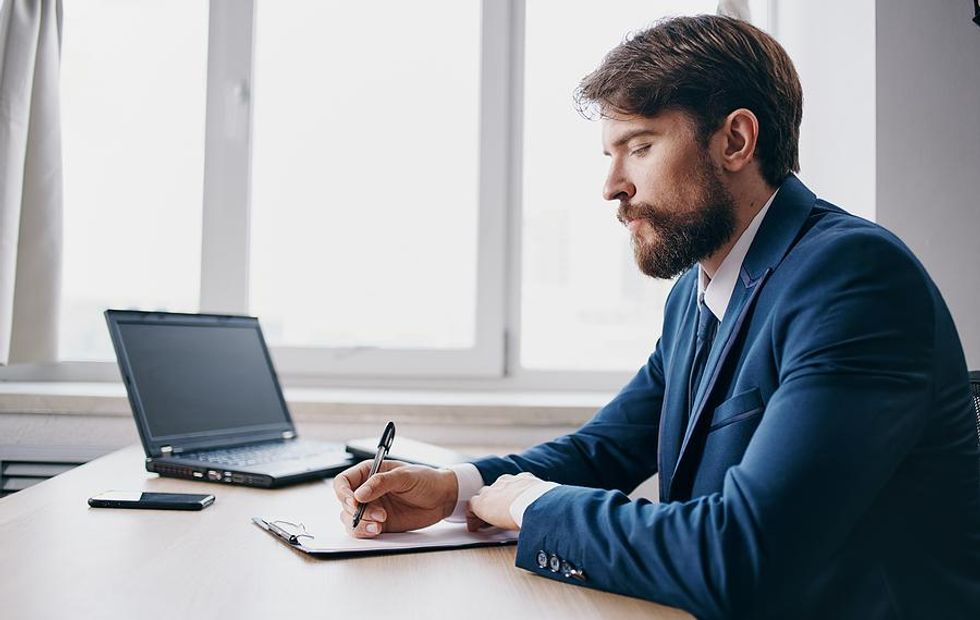 Professional man reviews his resume