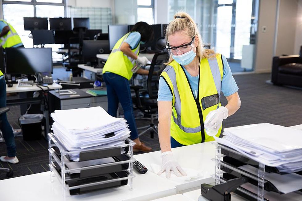 Safety professionals clean a workplace