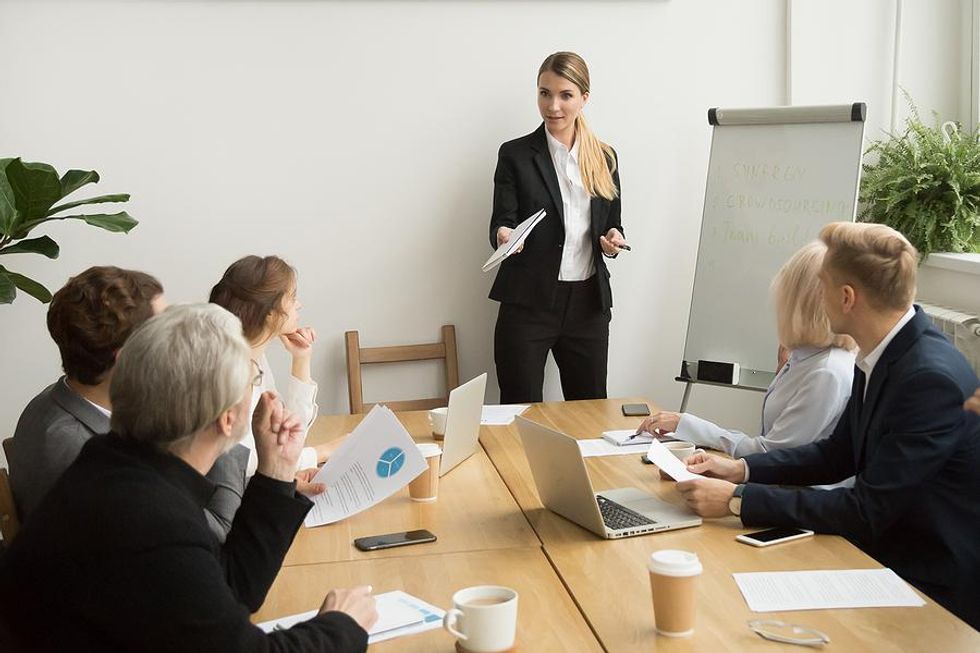 Woman leads a meeting at work