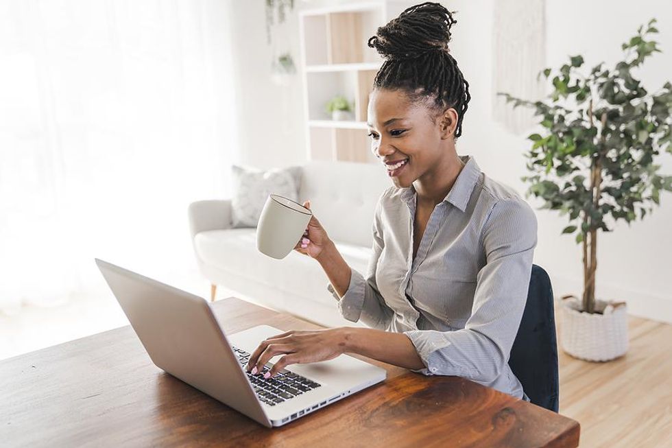 Woman on laptop tries freelancing for work